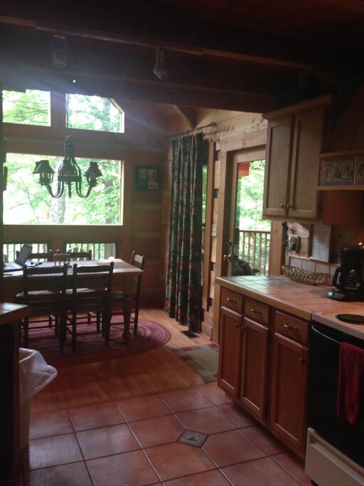 Dining open to kitchen and living area