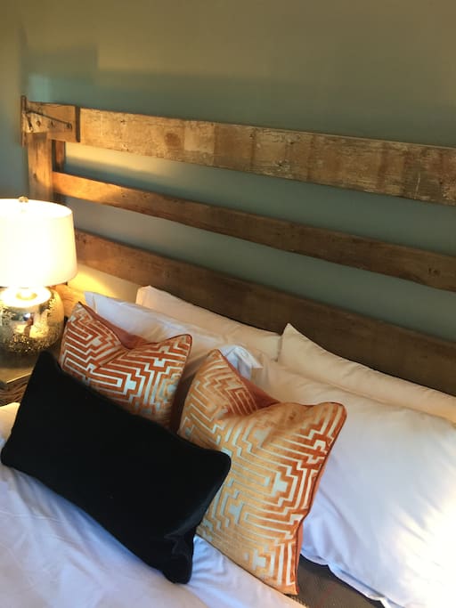 Bedroom 1-Queen bed with vintage field gate headboard, fully appointed with organic bedding and pillows. Down duvet with cover-100% cotton blankets.