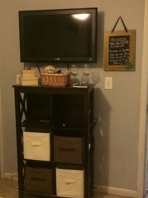 32" TV with additional storage in bedroom