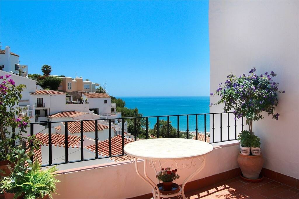 View from terrace to the beach and sea