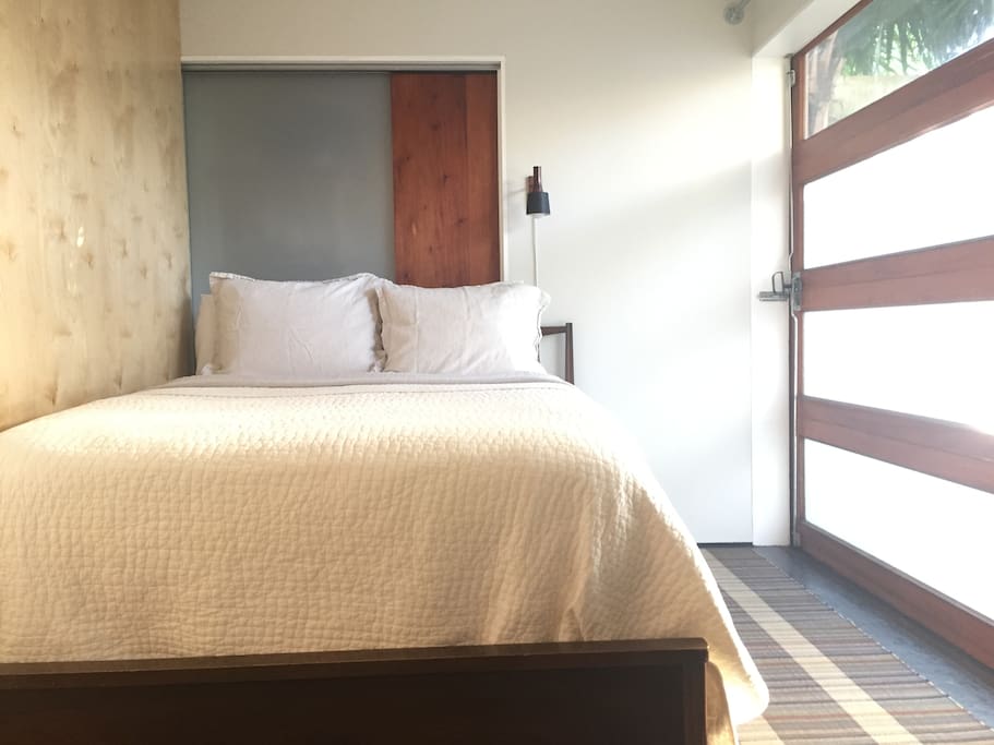 Full size vintage bed with comfortable mattress and quality linens.
