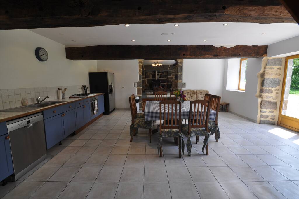 Large Open Plan Kitchen/Diner showing entrance to Living Room and Large Woodburner