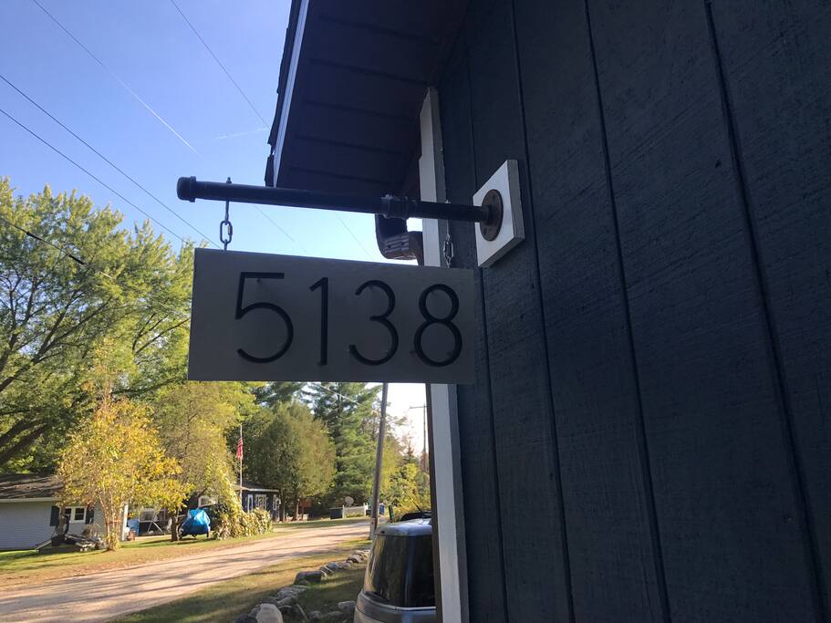 Look for the address sign as you drive down the road and approach the garage.