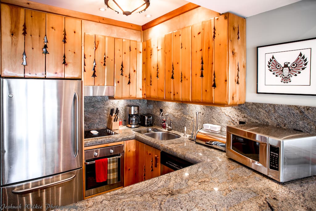 Modern updated kitchen, Stainless steel throughout, wine fridge, compactor garbage etc etc.