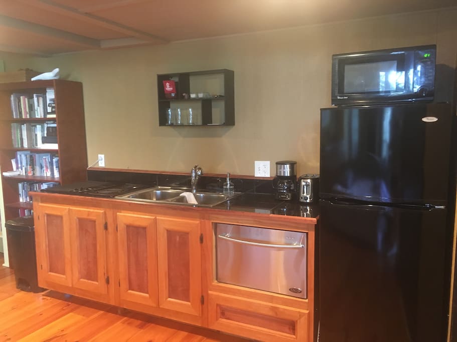 Kitchenette: sink, stovetop, fridge, DW, microwave, NO oven.
