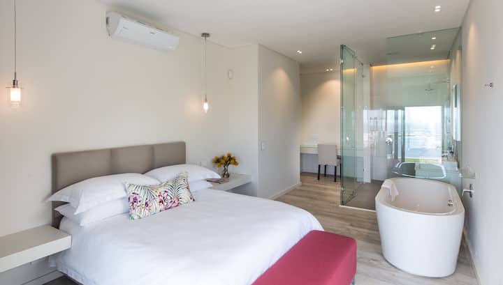 Bedroom 2 has a queen size bed with ensuite bathroom including a bath tub 