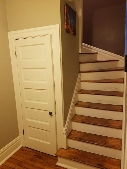 Spiral stair case leads to second floor bedroom