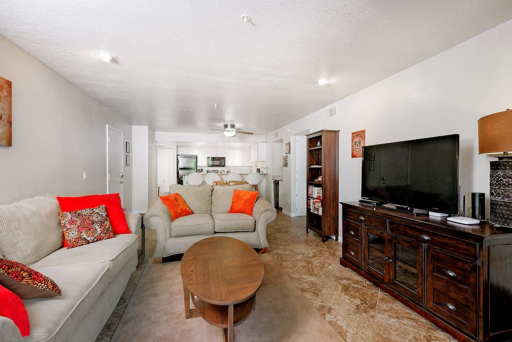 Open-concept living area with 50” flat screen TV. Complimentary Wi-Fi provided.