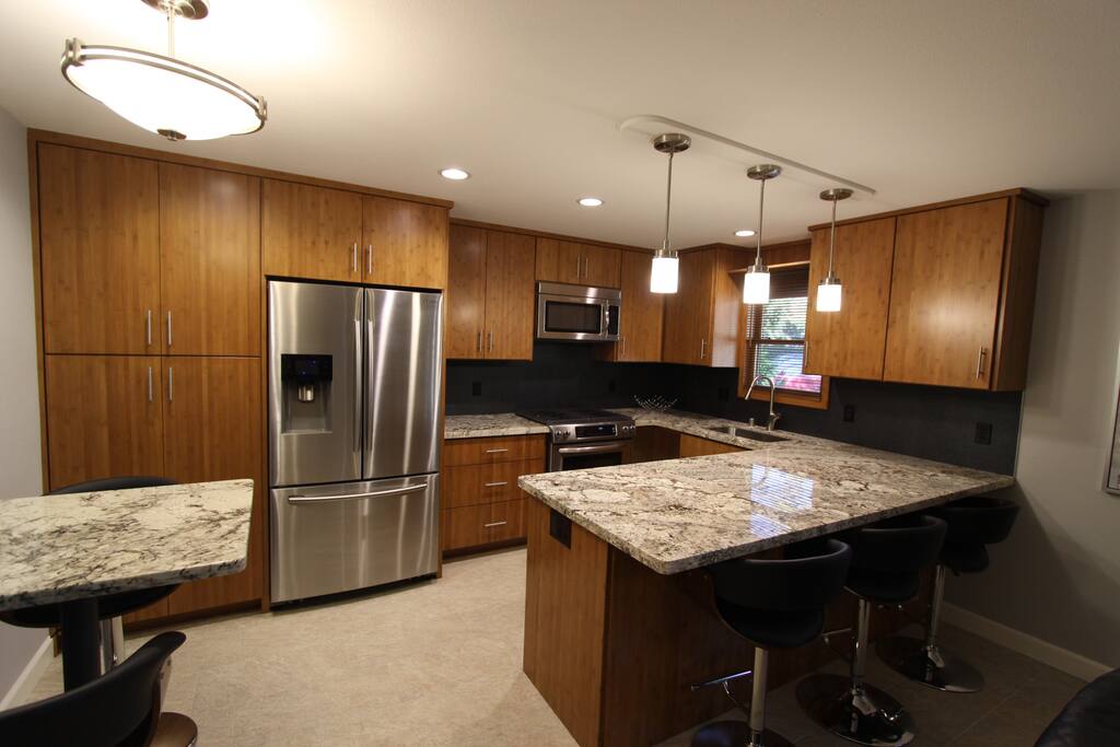 Custom Bamboo kitchen with full pantry and counter top bar
