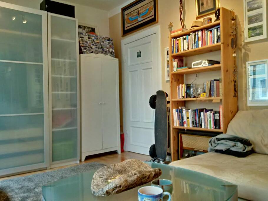 room to see the entrance door from the couch under the bed