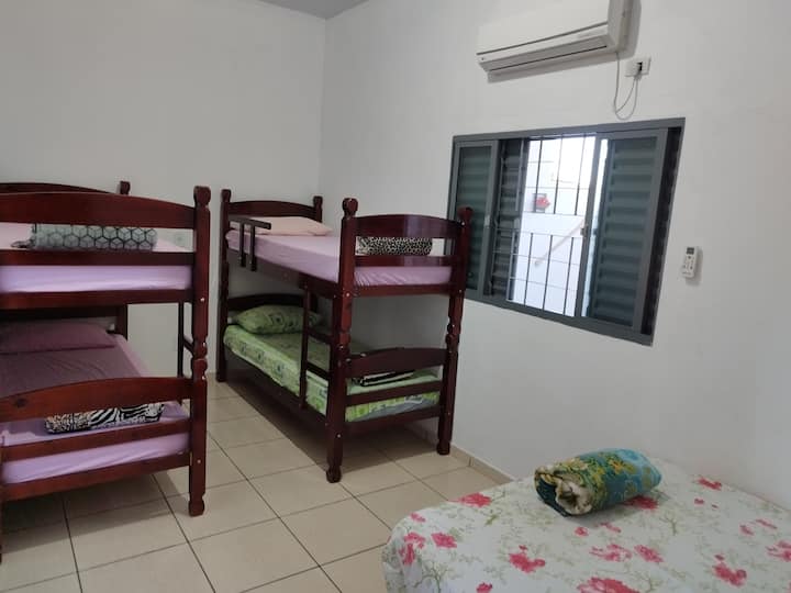 Bedroom (3) with air-conditioning, 1 double bed and 2 bunk beds.