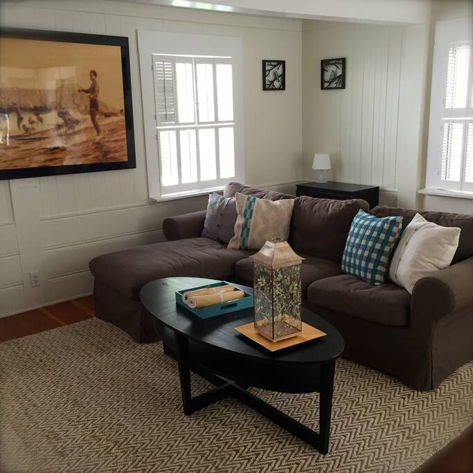 Living room with sofa bed is on the main level