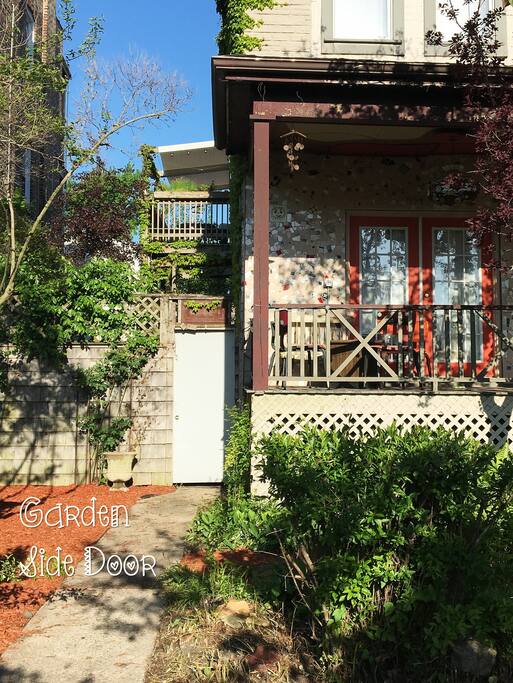 Entry through this side door, & walk to the back of the house