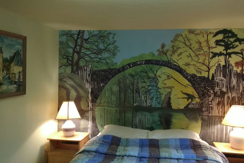 Bedroom has a beautiful mural and comfy bed. There's also a large closet for you.