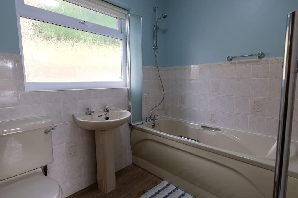 Bathroom with shower over bath