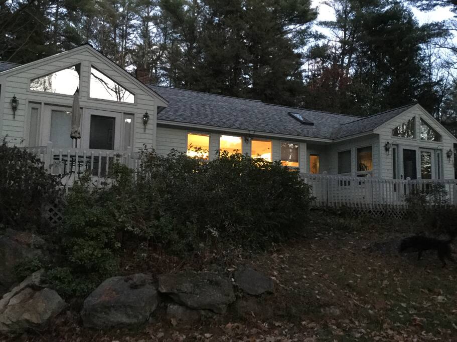 View of the Front of the house from driveway. Front deck is completely enclosed with gate.
