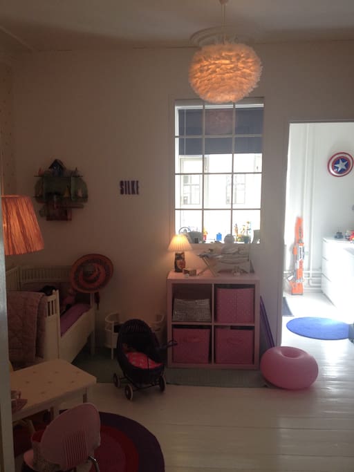 Girl room with bed and toys