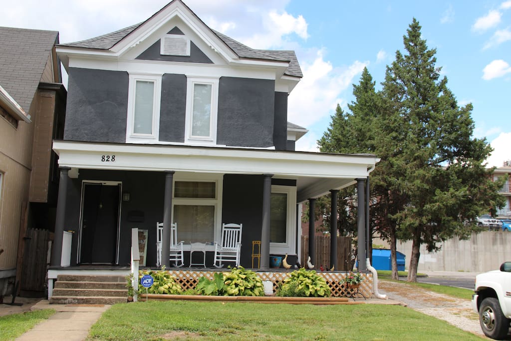 Front of house with long driveway for parking. Large wrap around porch facing Ann Avenue.