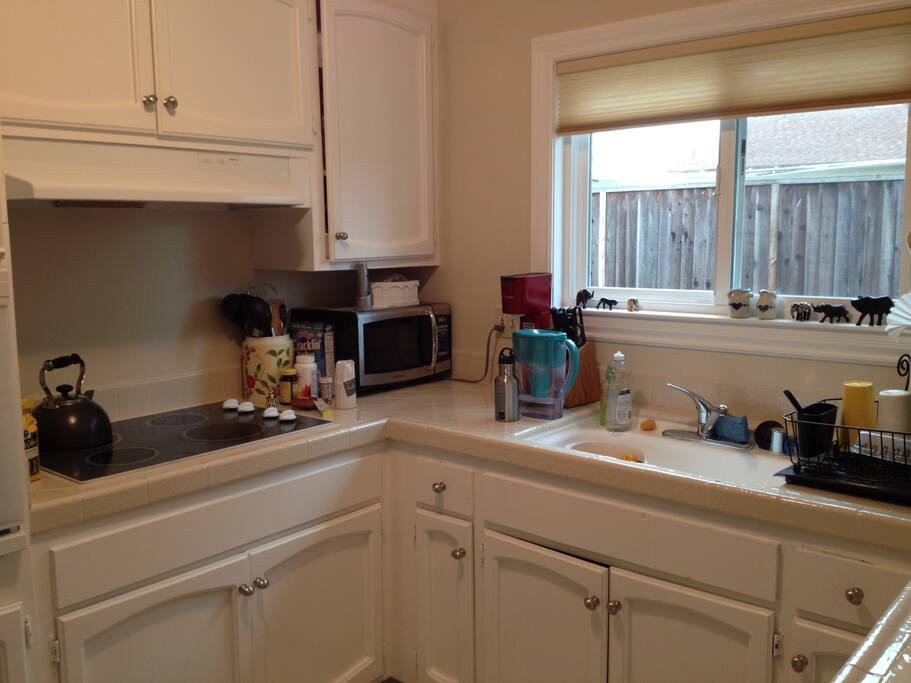 Kitchen with microwave, stove, oven and dishwasher.