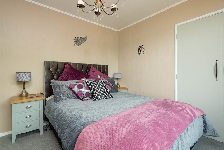 Luxurious upstairs Queen bedroom with ceiling candelabra 