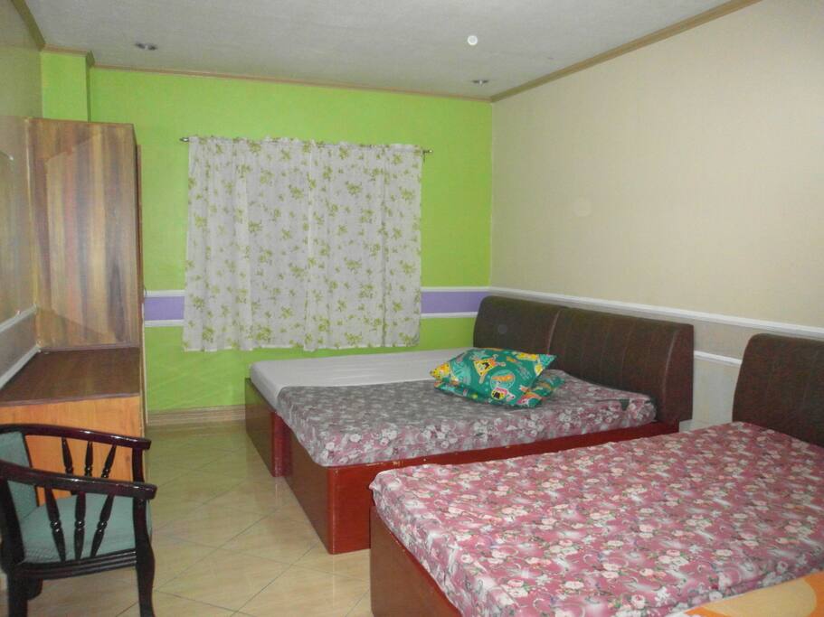 TWIN SHARING means only 2 single beds in a room. I was not able to get a twin sharing room but basically it only means 2 single beds in the room. we set up the room - here we are airing the beds. beddings are set up before guests arrive.