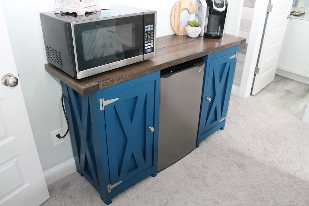 Microwave, Mini-Fridge, Keurig and Enjoy 2 waters, Coffee, Creamer, Sugar and Snacks on us.