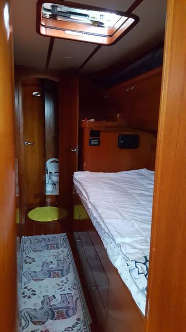 Forward cabin. double below and single bunk above. shared shower