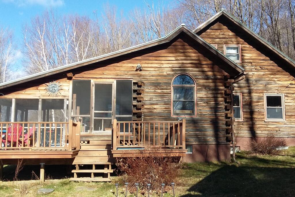 The cabin. An exposed sundeck leading into a covered two level deck. This leads to the mudroom entrance and to the fiery warmth of the living space!