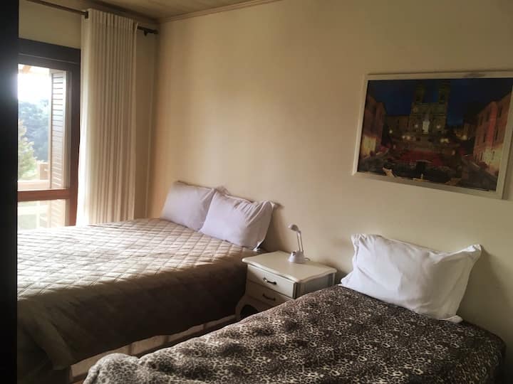 Triple bedroom with panoramic view and shared bathroom with the single room next door.