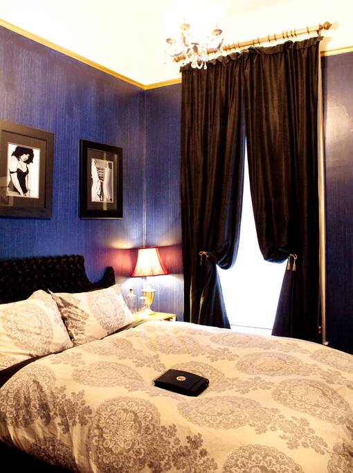 cozy guest room with blackout dupioni drapes for when you want to sleep in