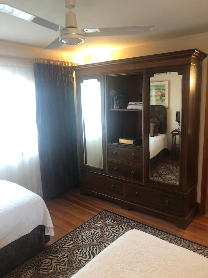 The large rich wood armoire provides plenty of space for all your clothing.