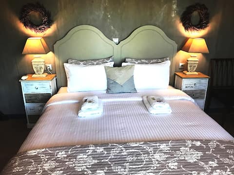 Deluxe suite pool view at Villa Vravrona Tower