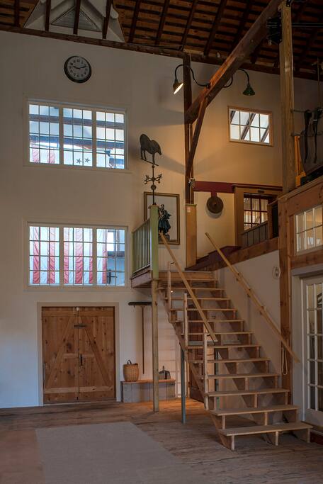 These stairs take one to the entrance door, to the loft. That is a photo of Lafayette at the top of the stairs. The door is to the right of the round disc, light is coming through the door window.