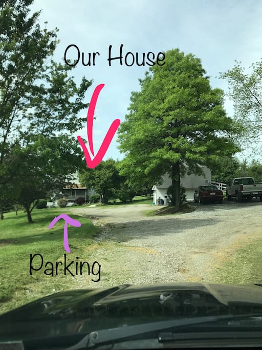 Our house from the driveway and guest parking is to the left
