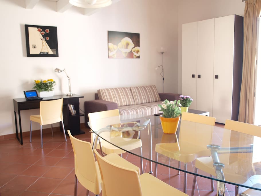 the large living room with desk and comfortable bed sofa