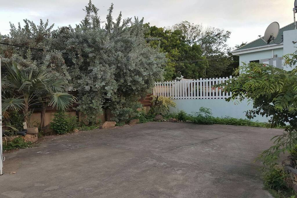 There is a paved parking area as you enter the gate.