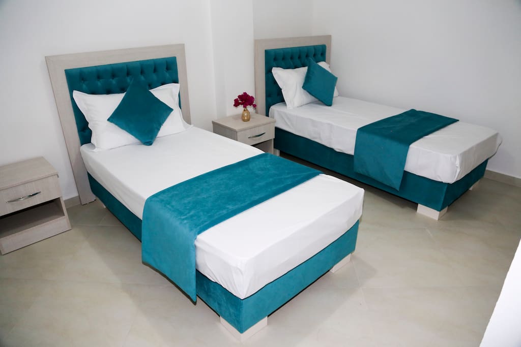 Second bedroom with two single beds.