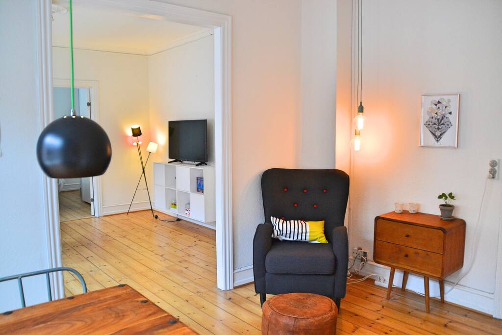 Small reading area with comfortable armchair and light