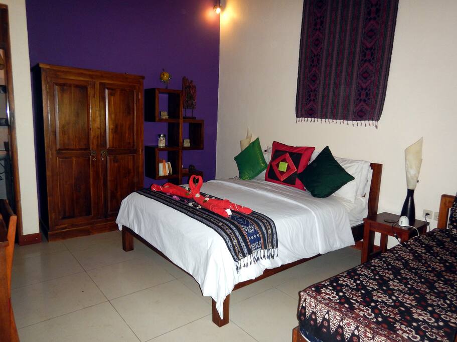 Queen sized bed and single bed in second bedroom