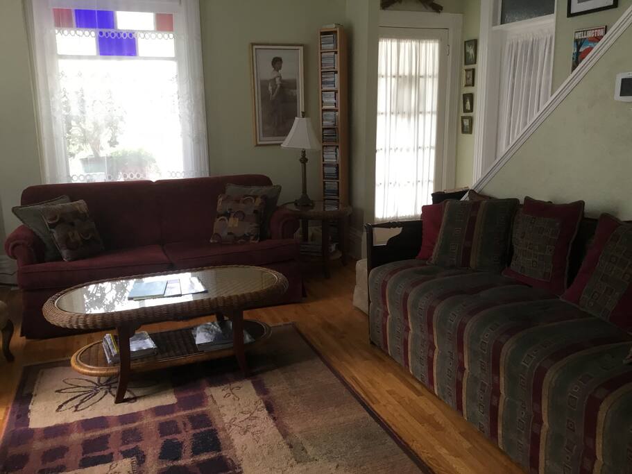 Living room with pull-out sofa bed and x long day bed can sleep three
