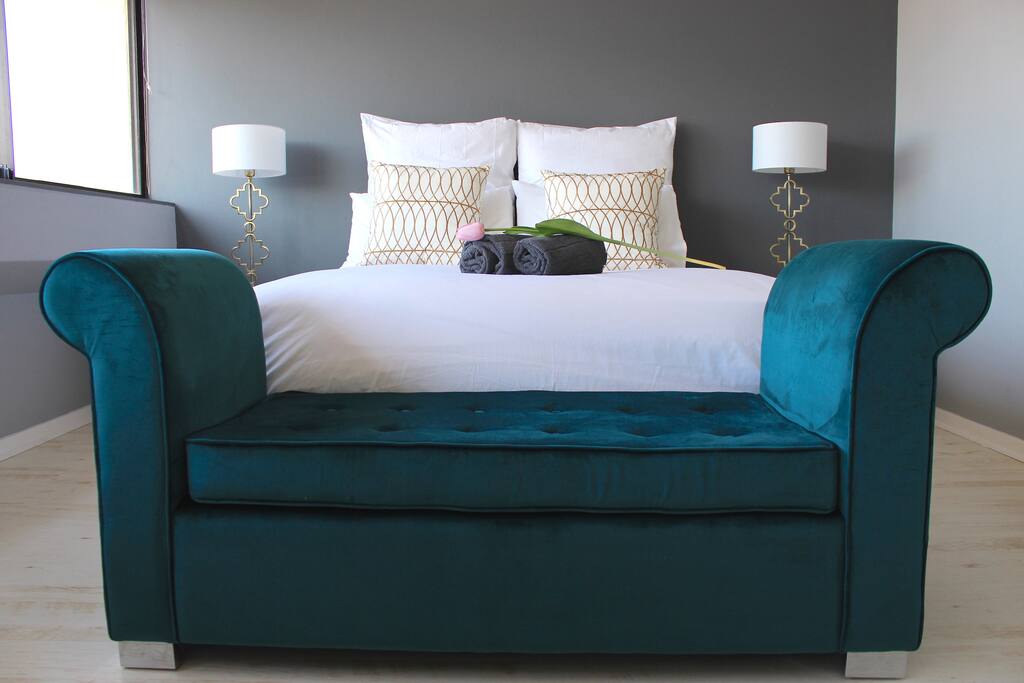 Comfy bed with velvet ottoman.