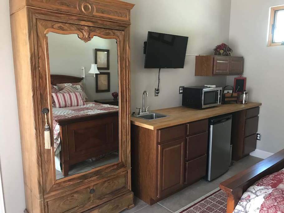 sink, small fridge, microwave, coffee maker, cable tv