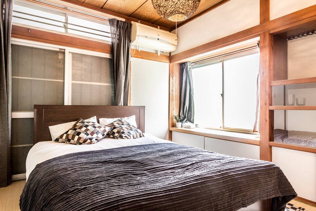 Sunny main bedroom with double bed
