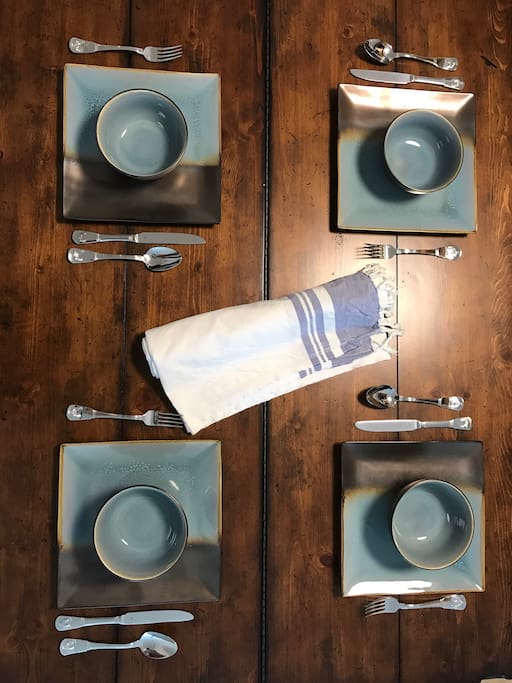Modern rustic dining table & stoneware constructed dinnerware.
