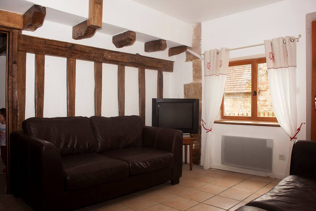 The lounge again, showing original beams where the cattle used to put their heads through to feed.