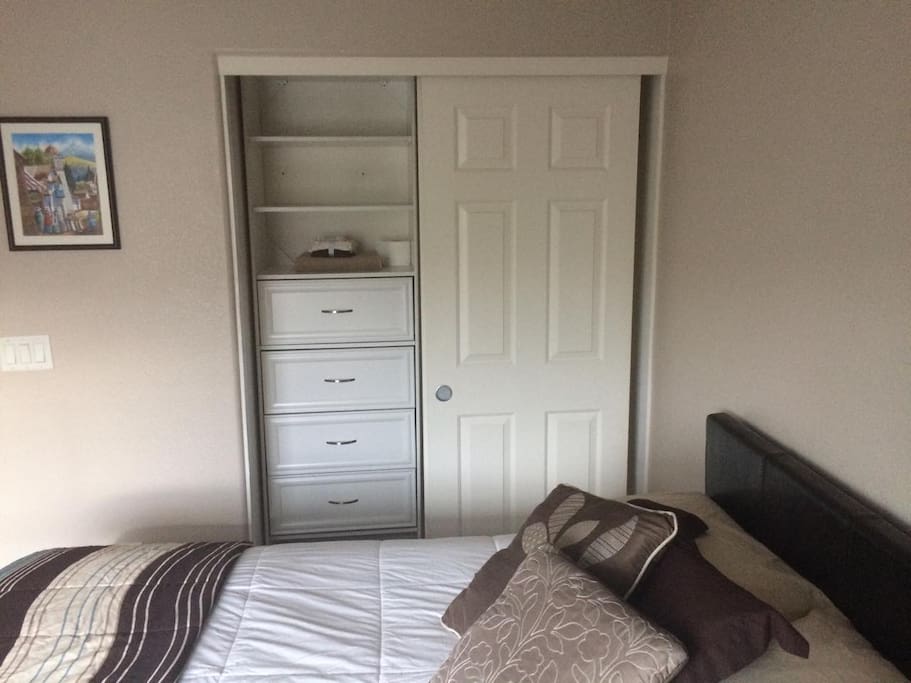 Closet with drawers and hanging area