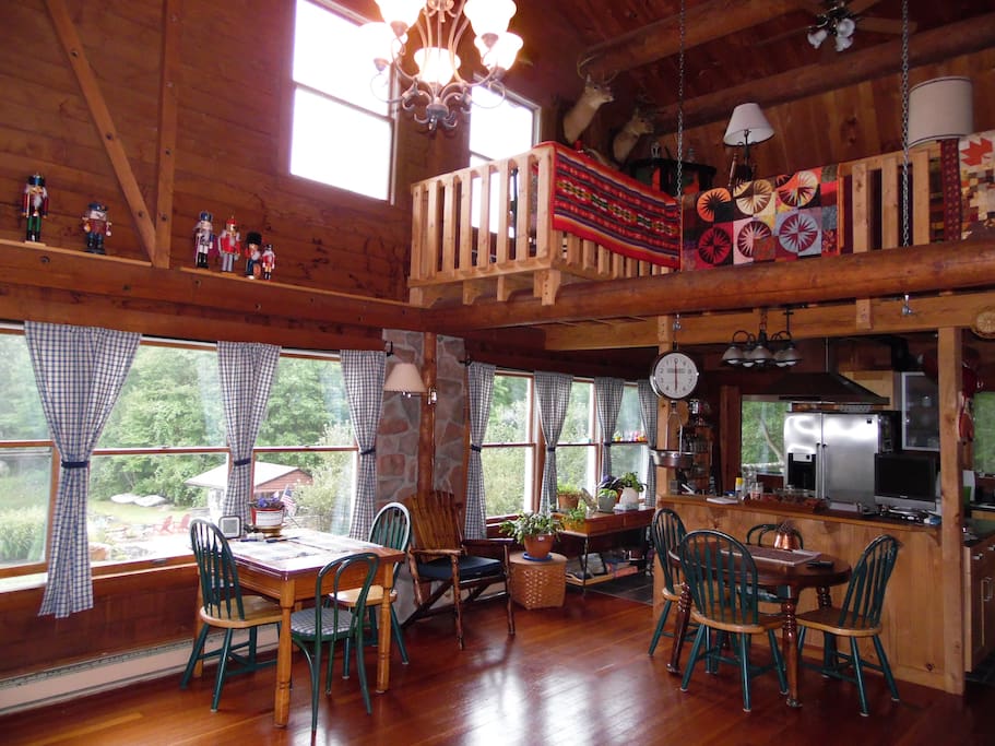 Enjoy breakfast in the main area with gorgeous quilt gracing the railing.