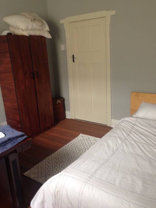 Queen bed and cupboard