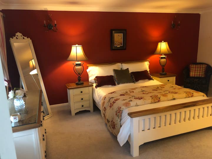 Relaxing spacious double room with ample storage.