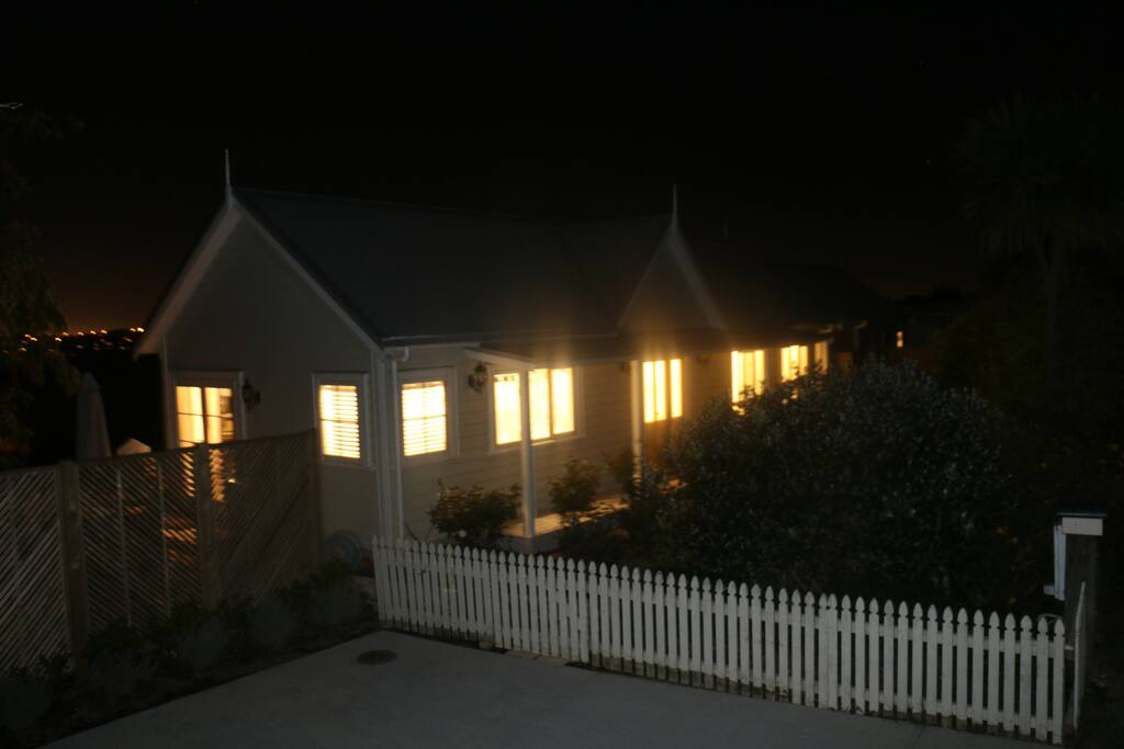 Longview Villa atop of a ridge line with city lights in the distance